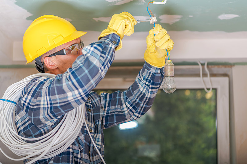 Electrician working on a house